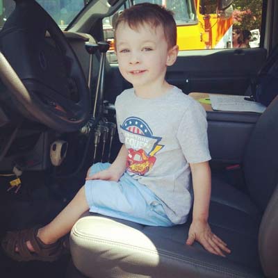 boy sitting in truck